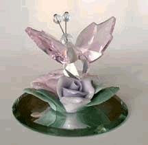 Crystal Butterfly With Pink Wings On Colorful Ceramic Flowers